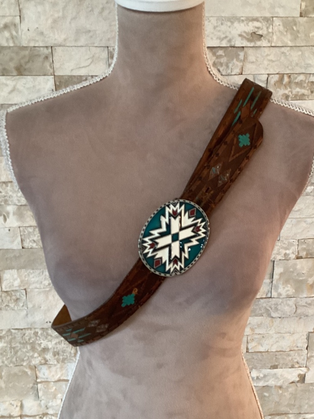 Vintage Siskiyou Buckle Co. enameled belt buckle paired with tooled leather belt